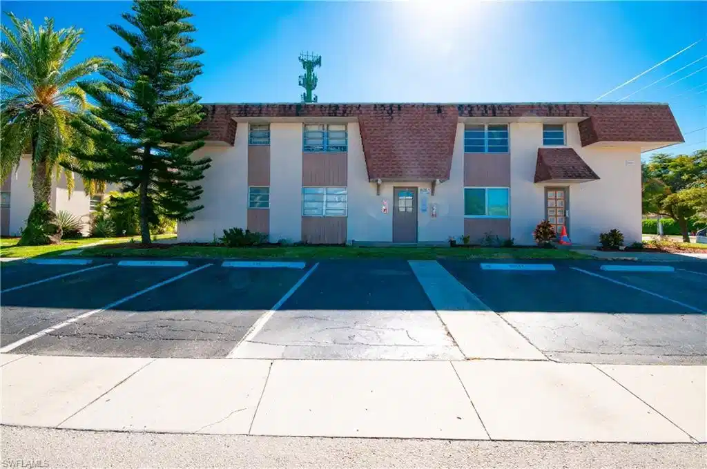 Image 1: Designated parking space is steps from the entrance.