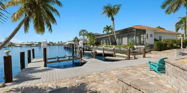 Image 4: Dock with boat lift and a water view