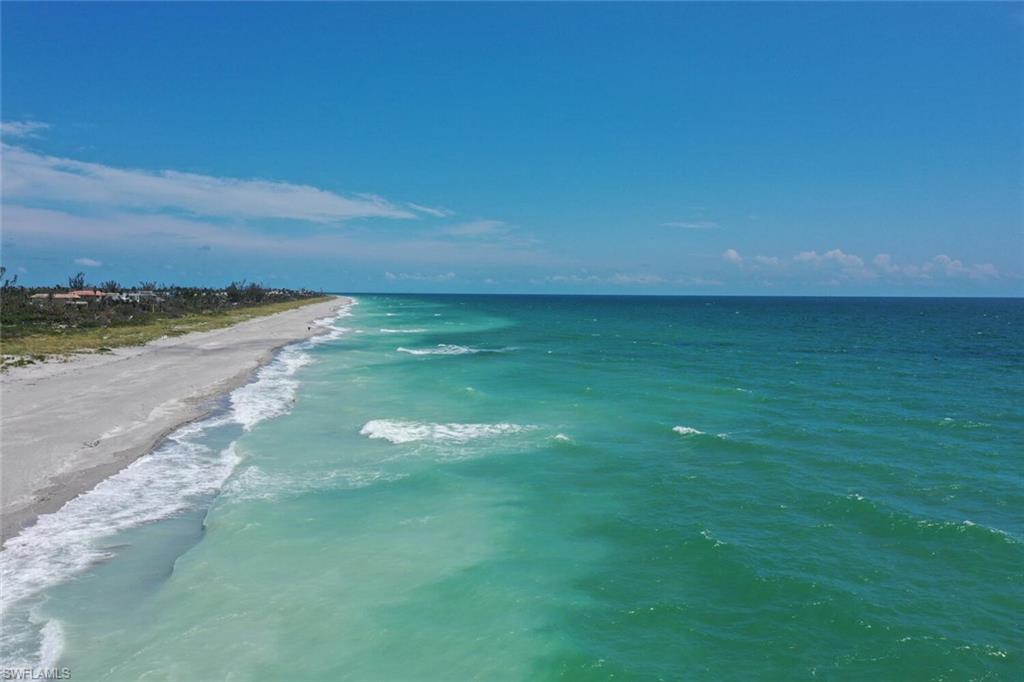 Image 4: Property view of water with a beach view