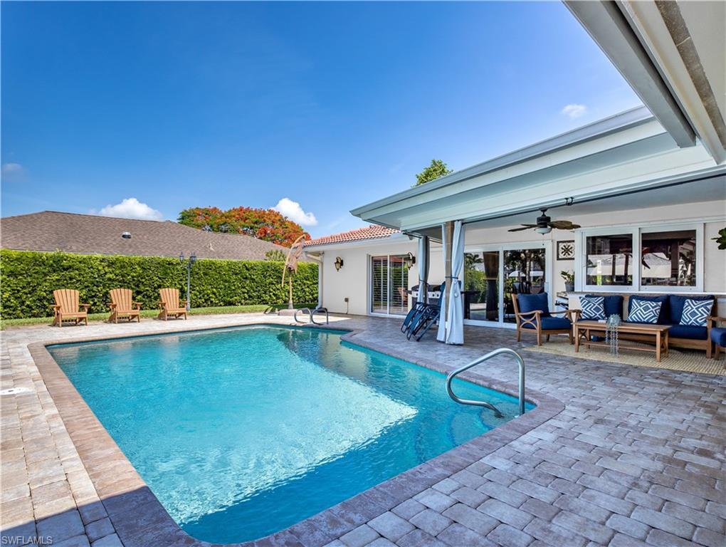 Image 4: View of swimming pool featuring ceiling fan, a patio area, and an outdoor living space