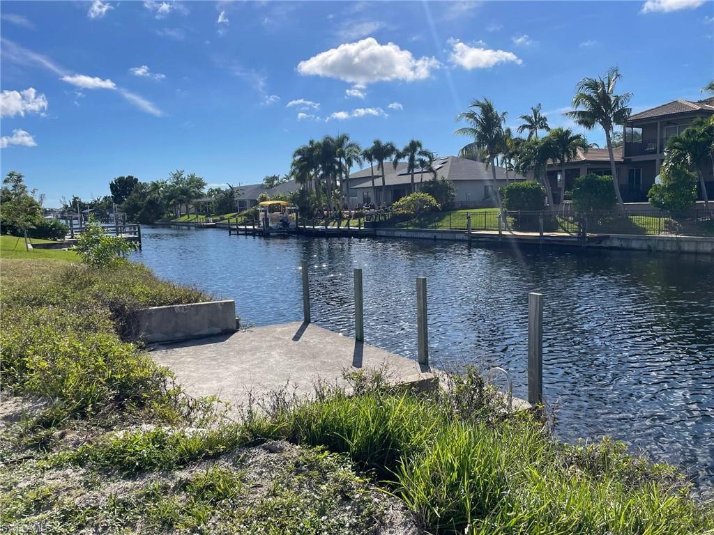 Image 3: Water view with a boat dock