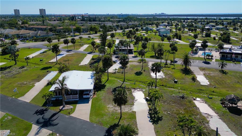 Image 4: Aerial perspective of suburban area with a park