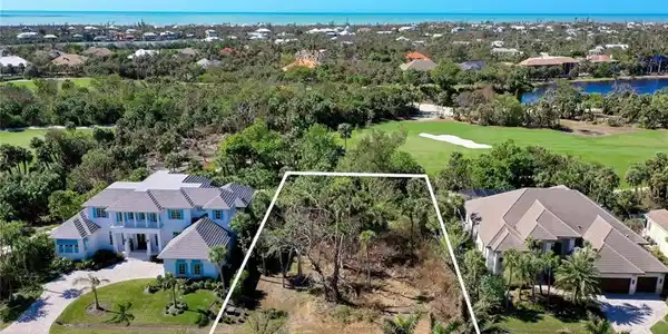 Image 2: Bird's eye view with a water view