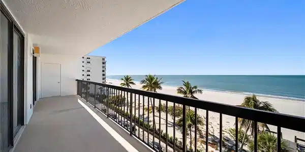 Image 2: Balcony with view of water and beach