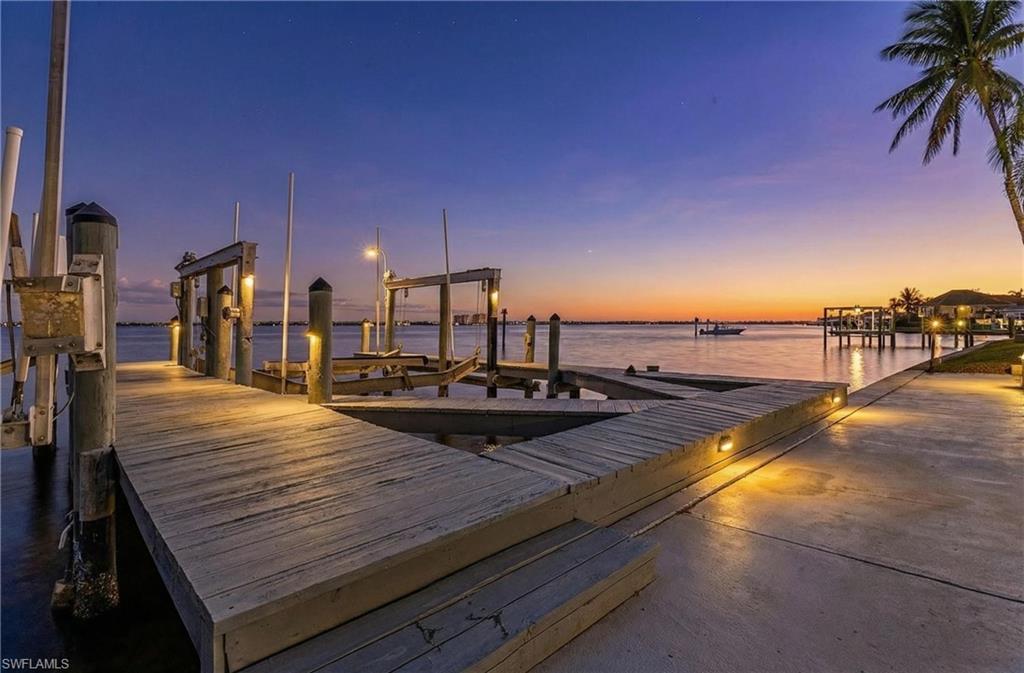 Image 4: Dock with boat lift and a water view