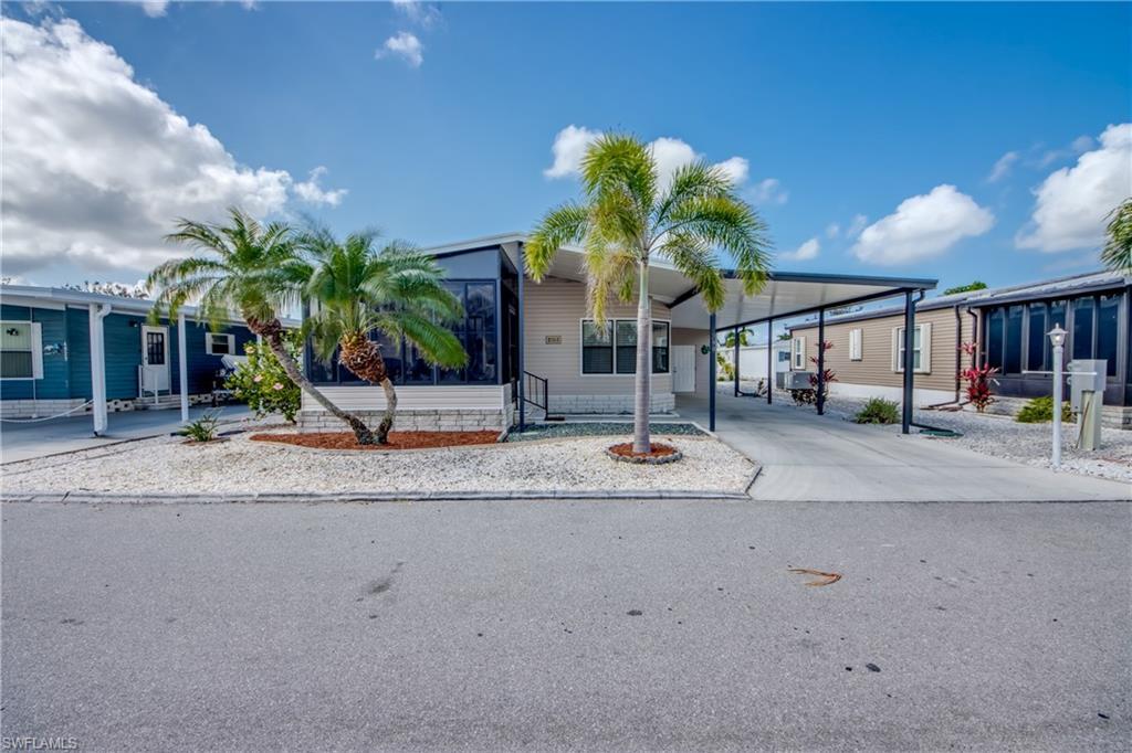 Image 2: Manufactured / mobile home with concrete driveway and a carport