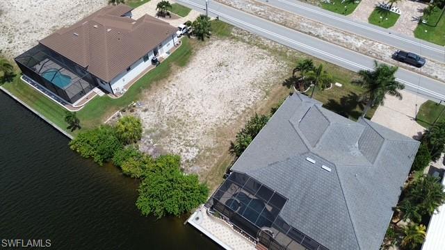 Image 1: Cleared building lot featuring waterfront access