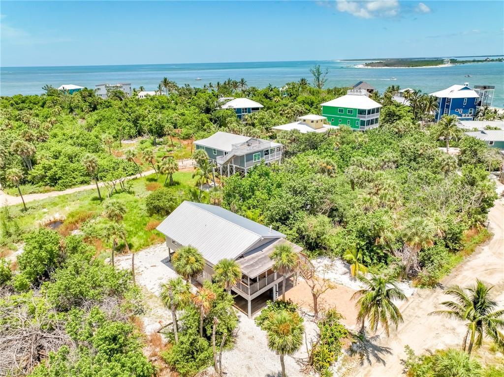 Image 3: Aerial view of property and surrounding area featuring a tree filled landscape