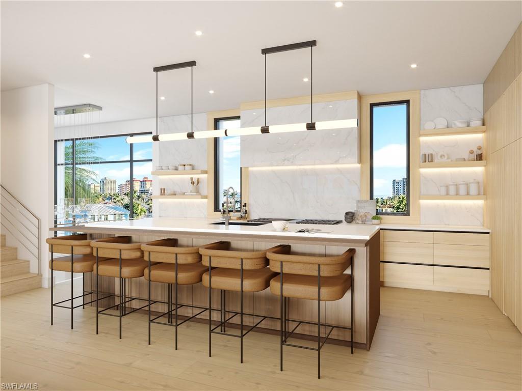 Image 1: Kitchen with custom cabinetry, and spacious quartz island