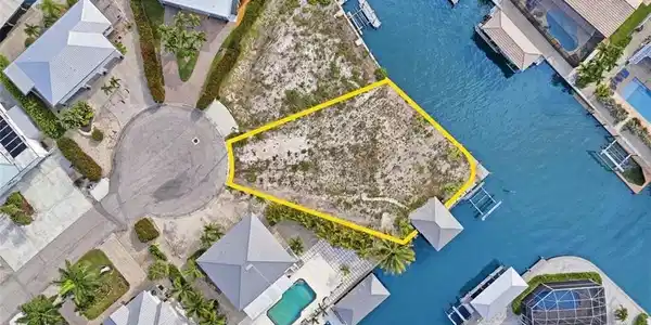 Image 4: Vacant land parcel featuring waterfront access and a cul-de-sac location - Virtually Edited Image