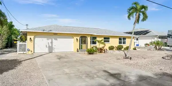 Image 4: Single story home featuring stucco siding, driveway, an attached garage, and a shingled roof