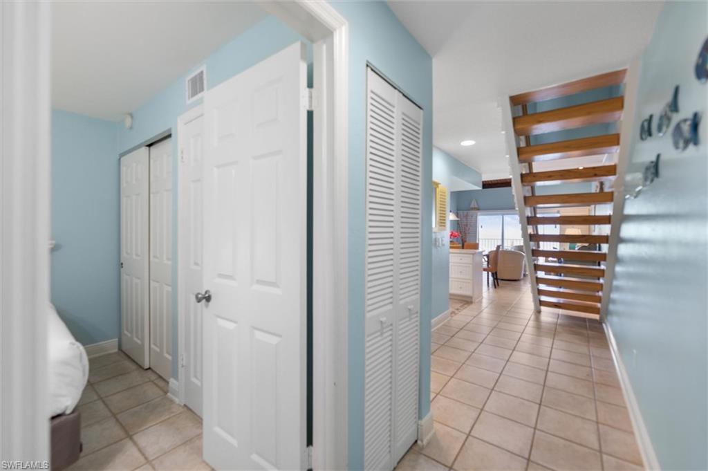 Image 4: Hall featuring light tile patterned floors and recessed lighting