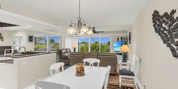 Image 4: Dining space with a chandelier, light hardwood / wood-style flooring, and a wealth of natural light