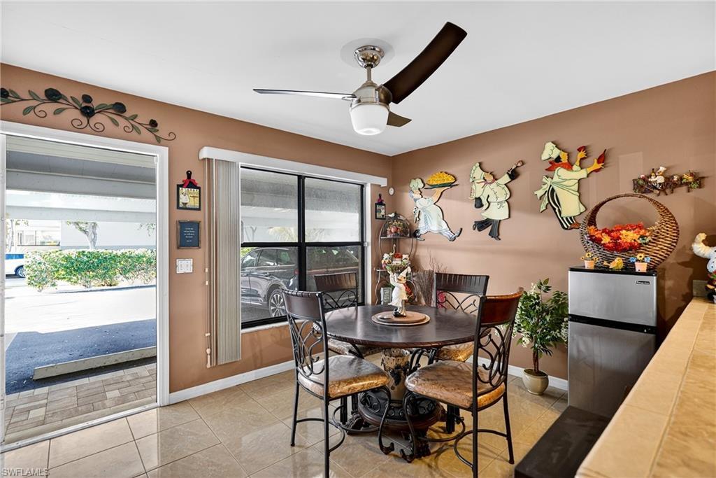 Image 3: Dining room with ceiling fan and light tile patterned floors