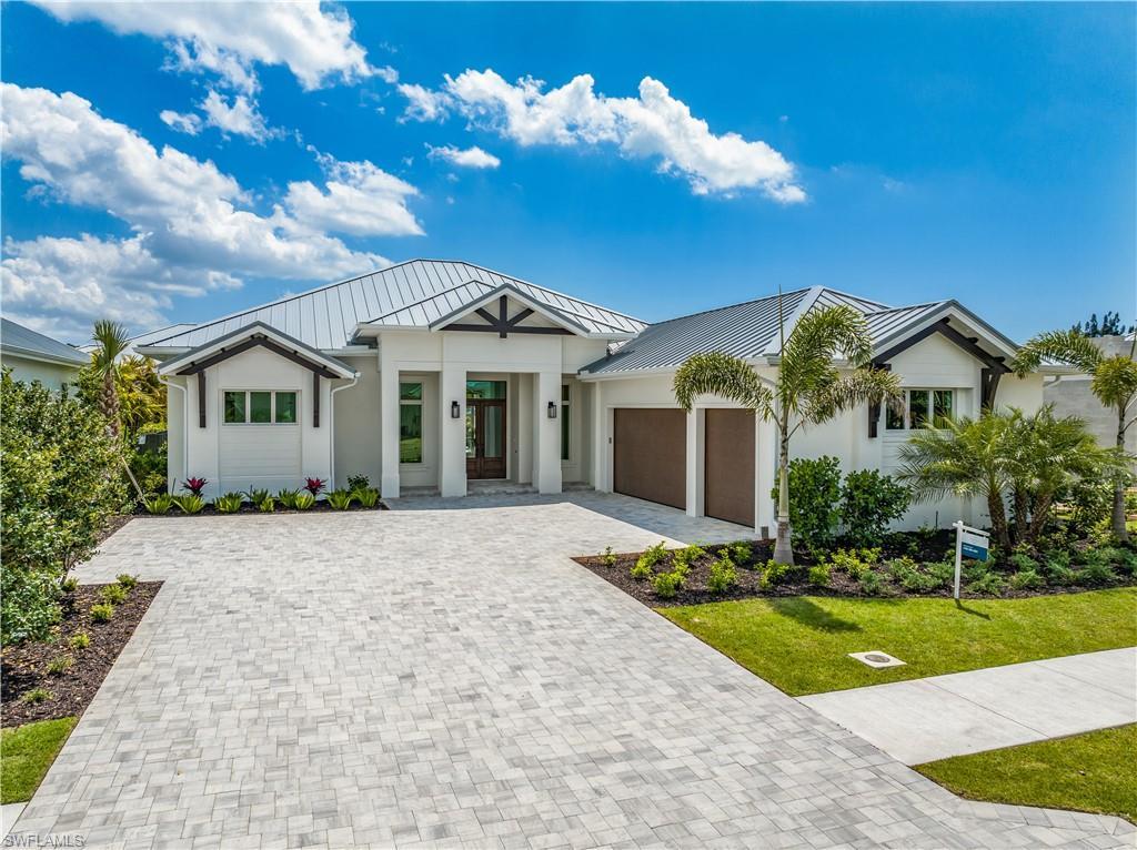 Image 1: 4554 Seagrove Landing Way is a pre-construction customized Dune plan purchase agreement. The photos in this listing are of a recently constructed and staged Dune plan with similar materials and features in the same community. This plan may be built as shown or customized.