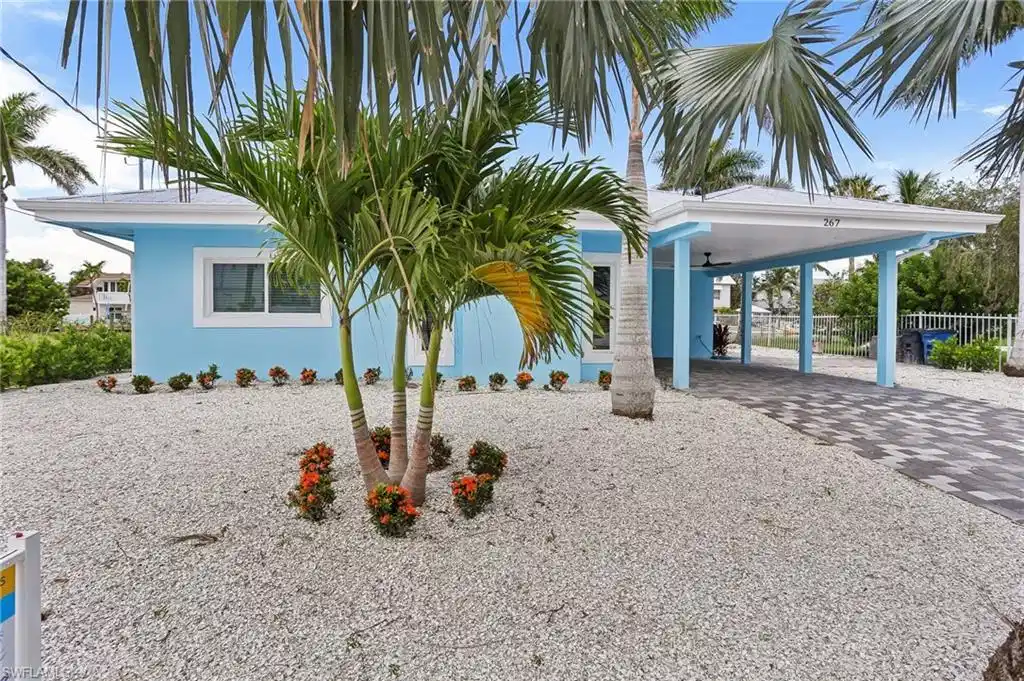 Image 1: View of front of home with a carport