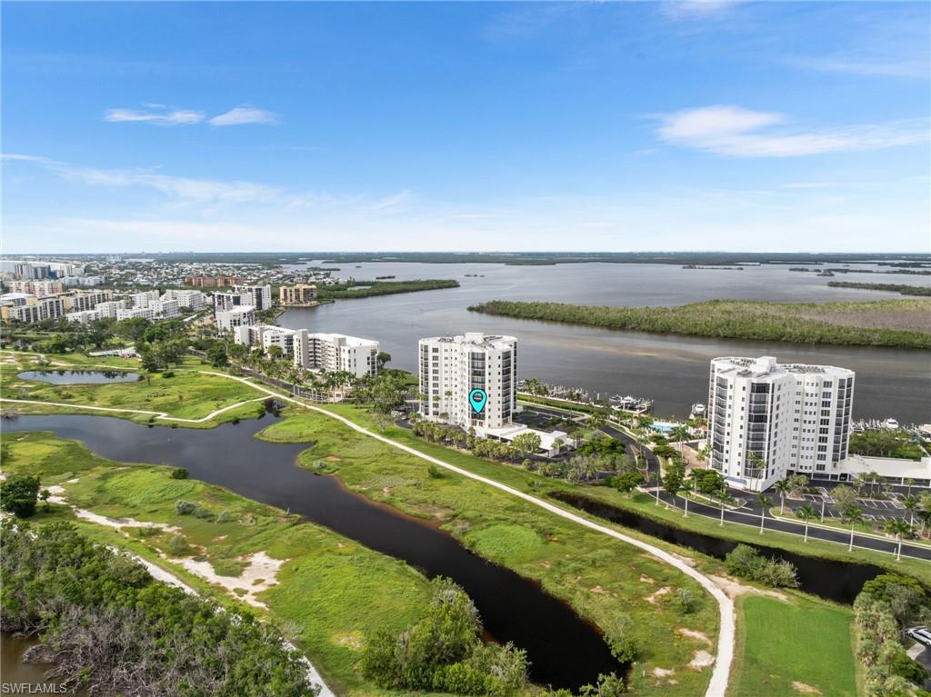 Image 3: View of urban area with apartment complex / building and a nearby body of water