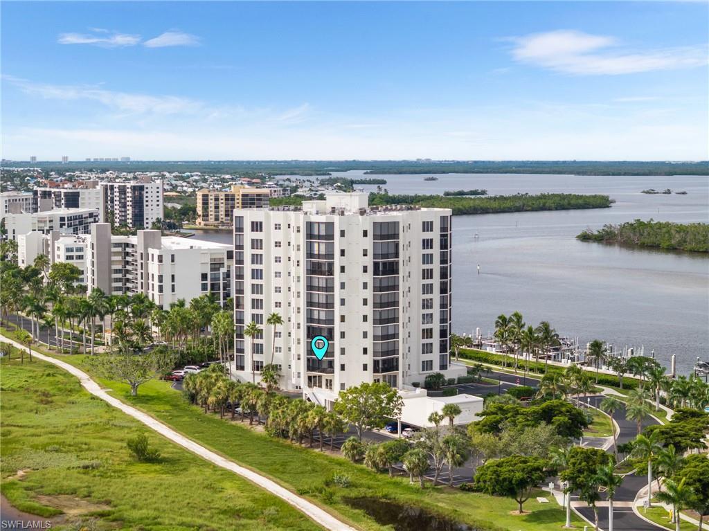 Image 4: Aerial view of apartment complex / building and a nearby body of water