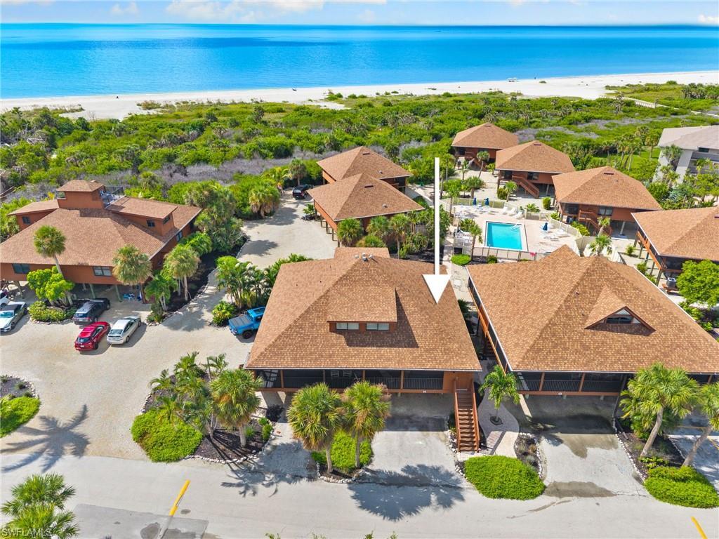 Image 3: Aerial view of a pool area and extended coastline