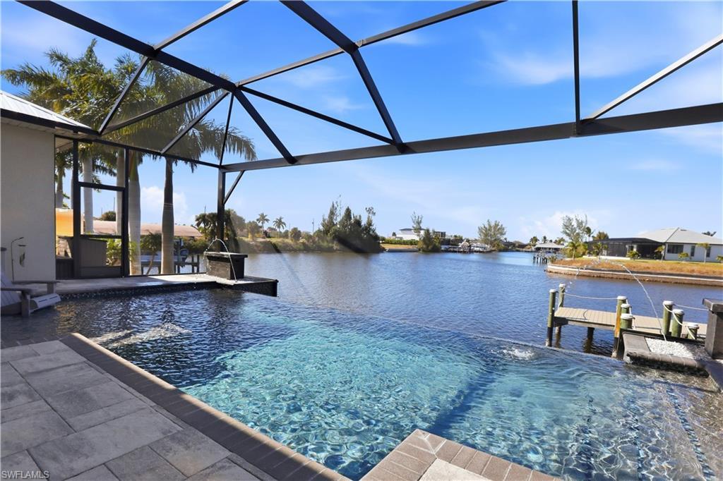 Image 3: View of Infinity Edge swimming pool from the lanai and a deep water view with DIRECT ACCESS to the GULF with NO BRIDGES!