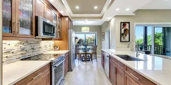 Image 2: Updatd kitchen with designer tile , upscale appliances and quartz countertops
