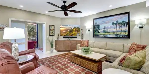 Image 3: Relax in one of these leather chairs as part of the furnishings for this Pelican Bay gem