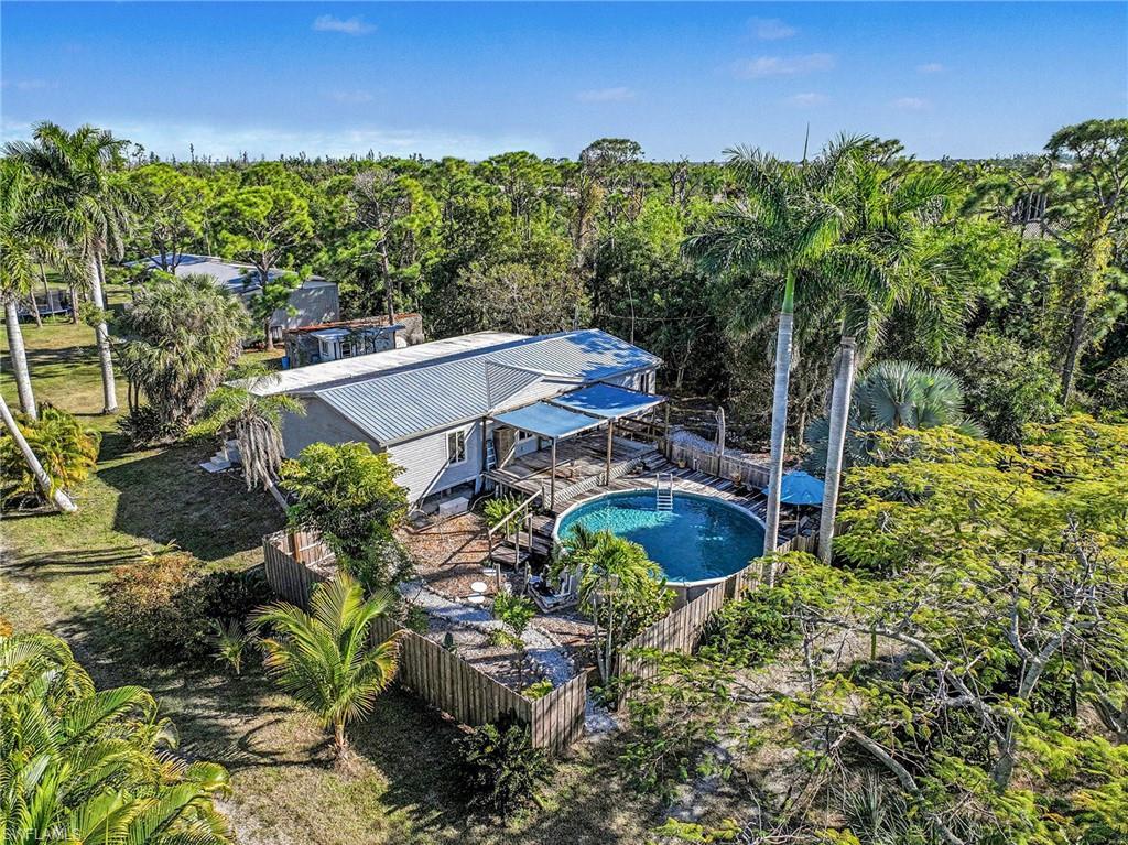 Image 1: View from above of property featuring a pool