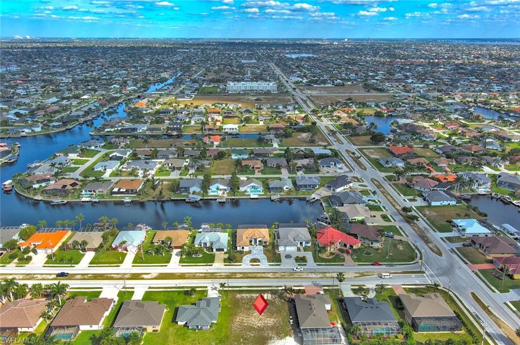 Image 1: Bird's eye view featuring a water view