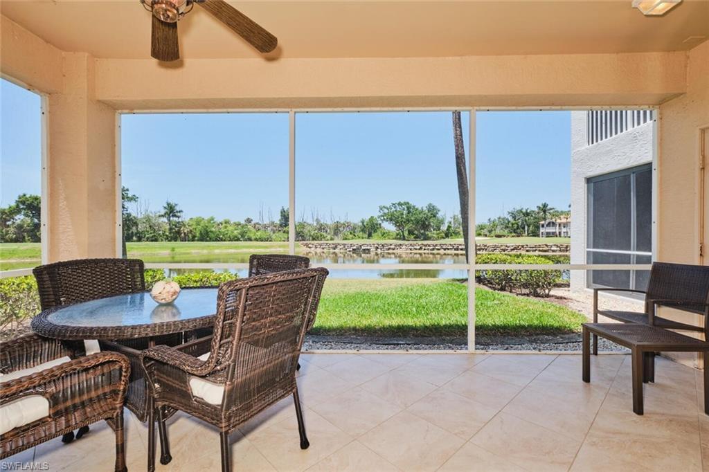 Image 3: Sunroom / solarium with ceiling fan, a water view, and outdoor dining area