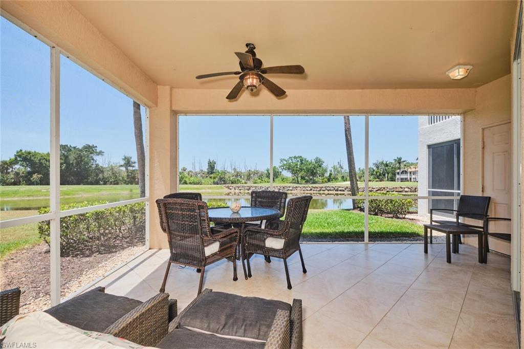 Image 4: Sunroom with a ceiling fan, a water view, and outdoor dining space