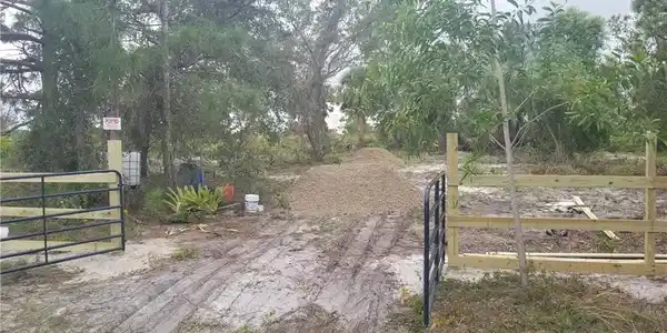 Image 2: View of entrance gate and driveway fill at install