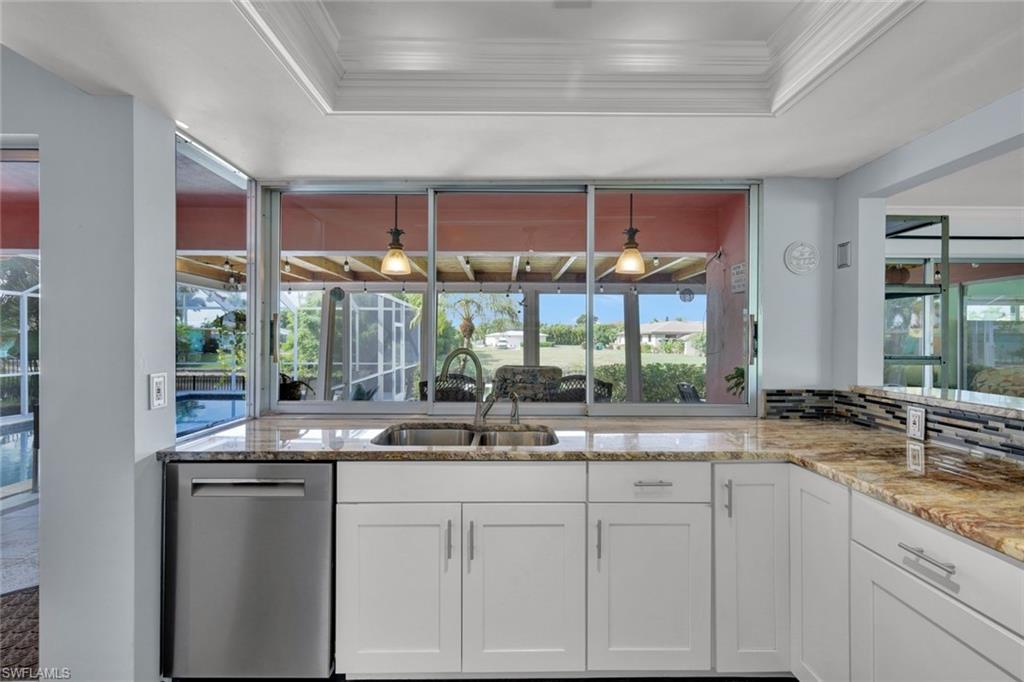 Image 3: Living room featuring ornamental molding, a ceiling fan, and light tile patterned flooring