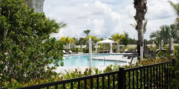 Image 4: View of pool with a gazebo and a patio area