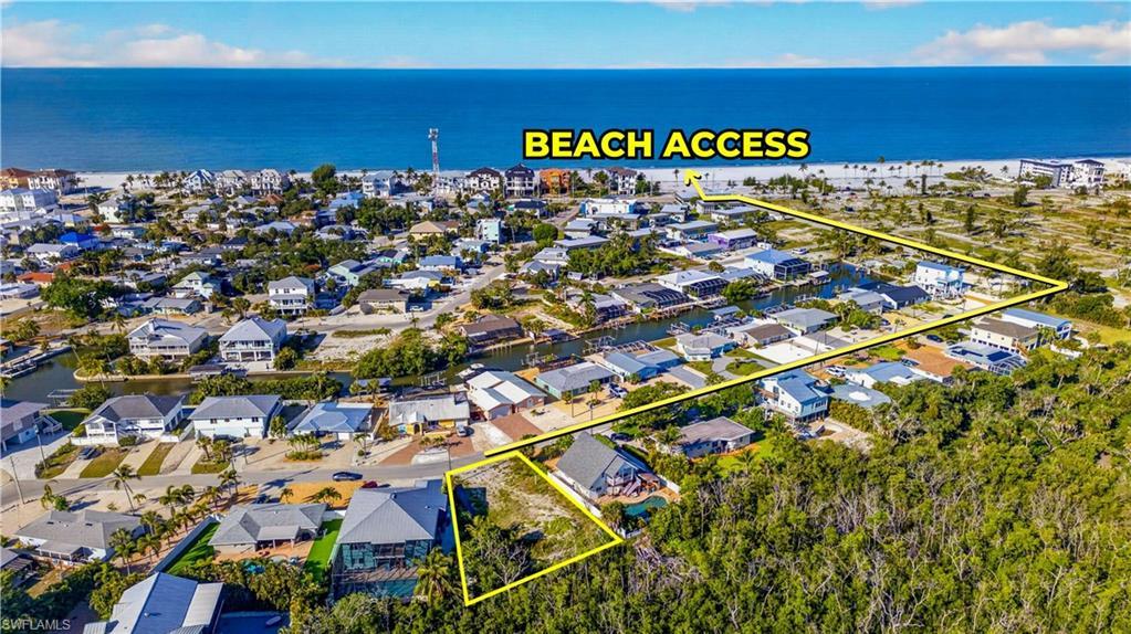 Image 2: Aerial overview showcasing a coastal community with direct beach access - Virtually Edited Image