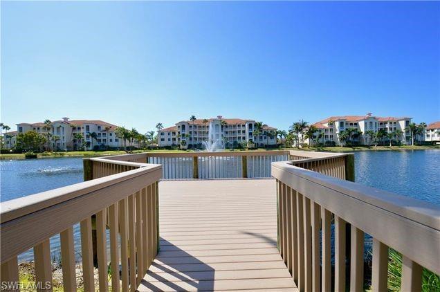 Image 4: Dock featuring a water view