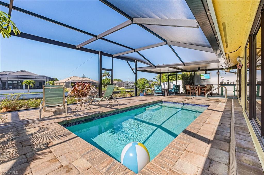 Image 2: Pool deck with custom screen enclosure