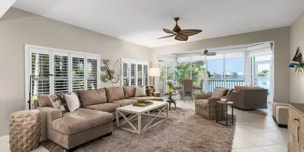 Image 4: Spacious living room with plantation shutters