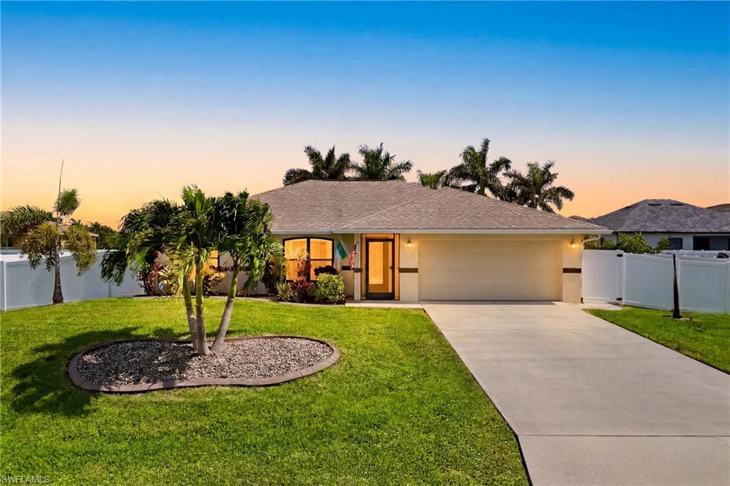 Image 2: Turnkey furnished and move-in ready, this beautifully maintained Southwest Cape Coral home sits on a rare fenced triple lot offering exceptional privacy and curb appeal.