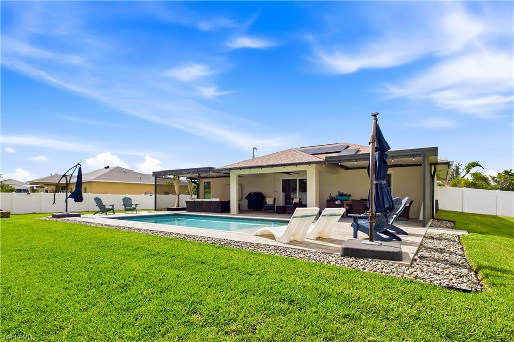 Image 4: View of the back patio and the pool!