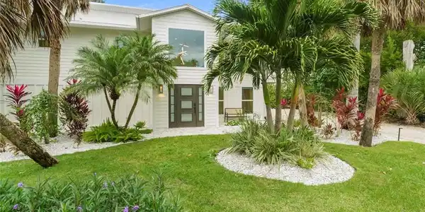 Image 2: View of front of house featuring a front yard