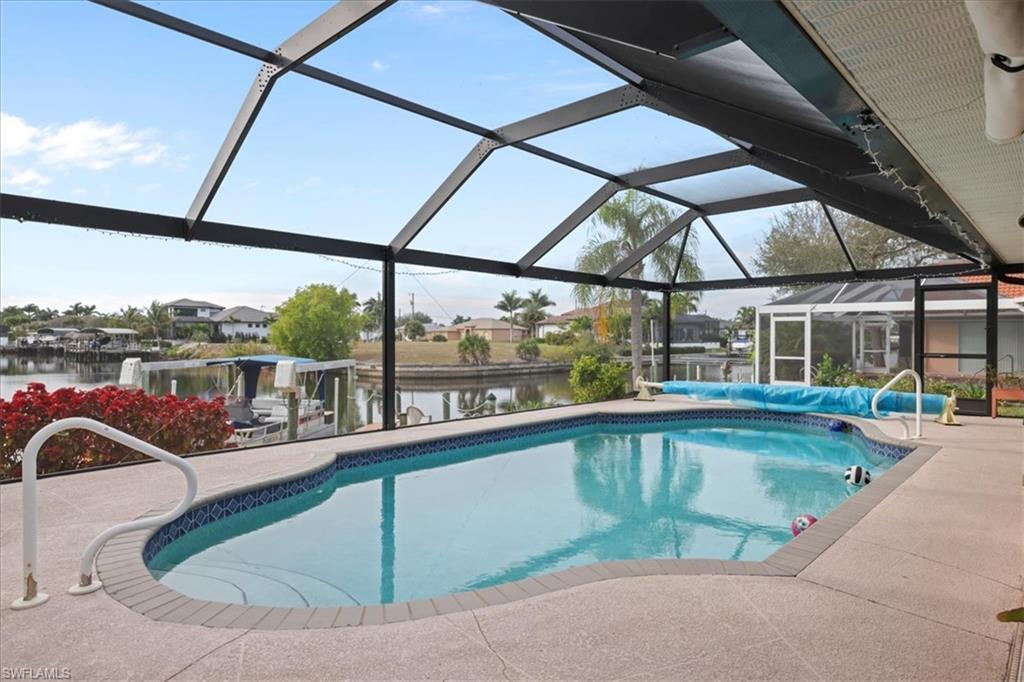 Image 2: Swimming pool with a water view