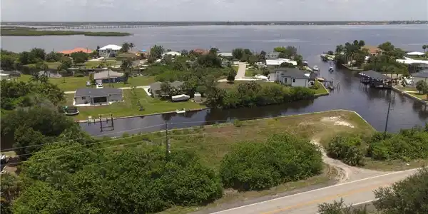 Image 2: Aerial View of Lot with the Peace River beyond the next block