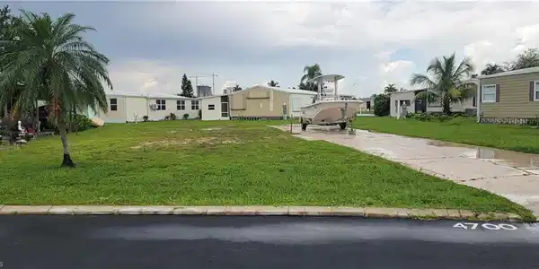 Image 3: View of property with a front yard