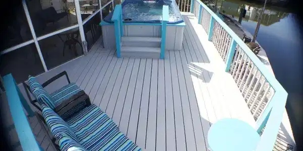 Image 3: Wooden deck with a hot tub