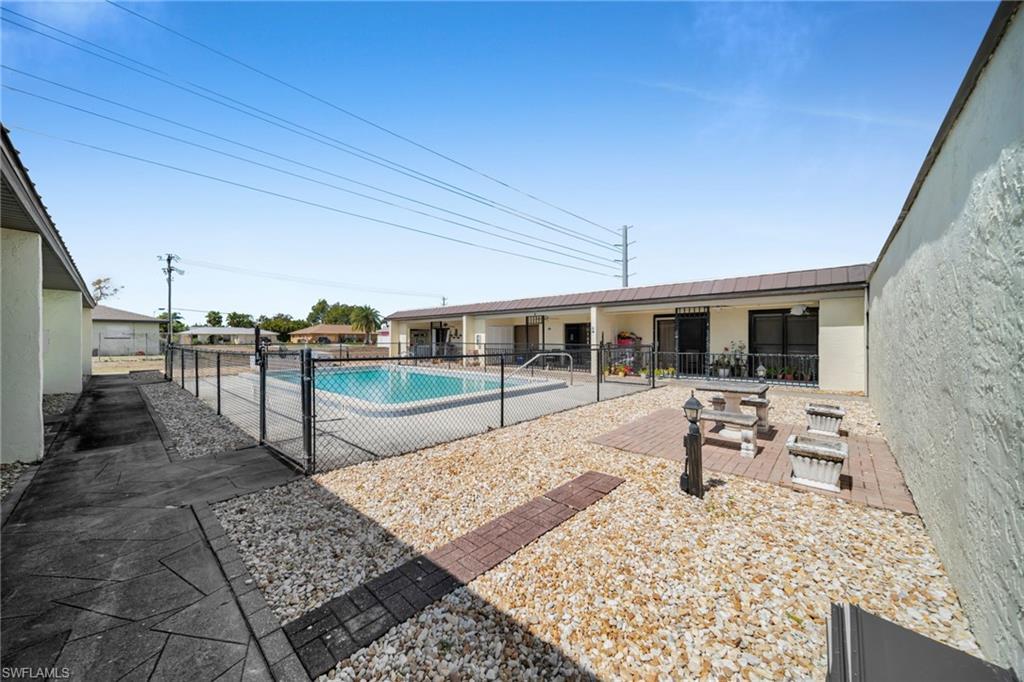Image 4: Community pool featuring a patio