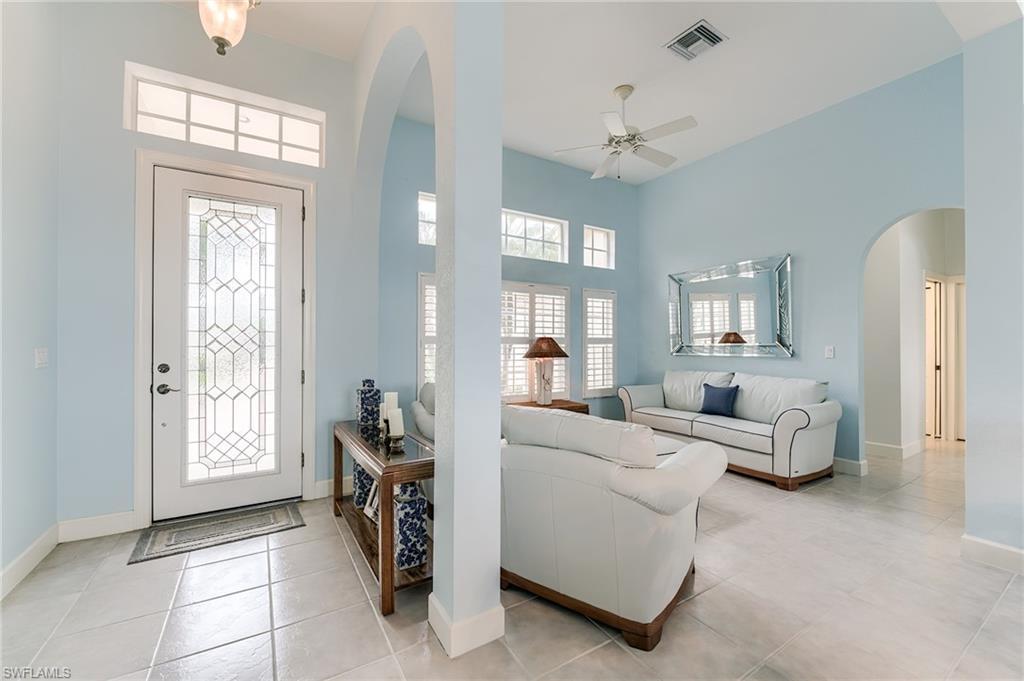 Image 4: Cocktail and conversation area off the entrance foyer.  This room can also serve as a formal dining room