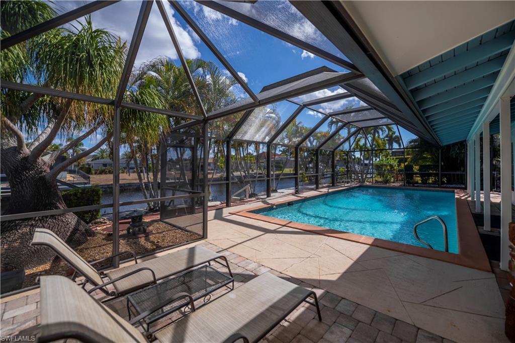 Image 3: Beautiful Heated pool and lanai area overlooking the water