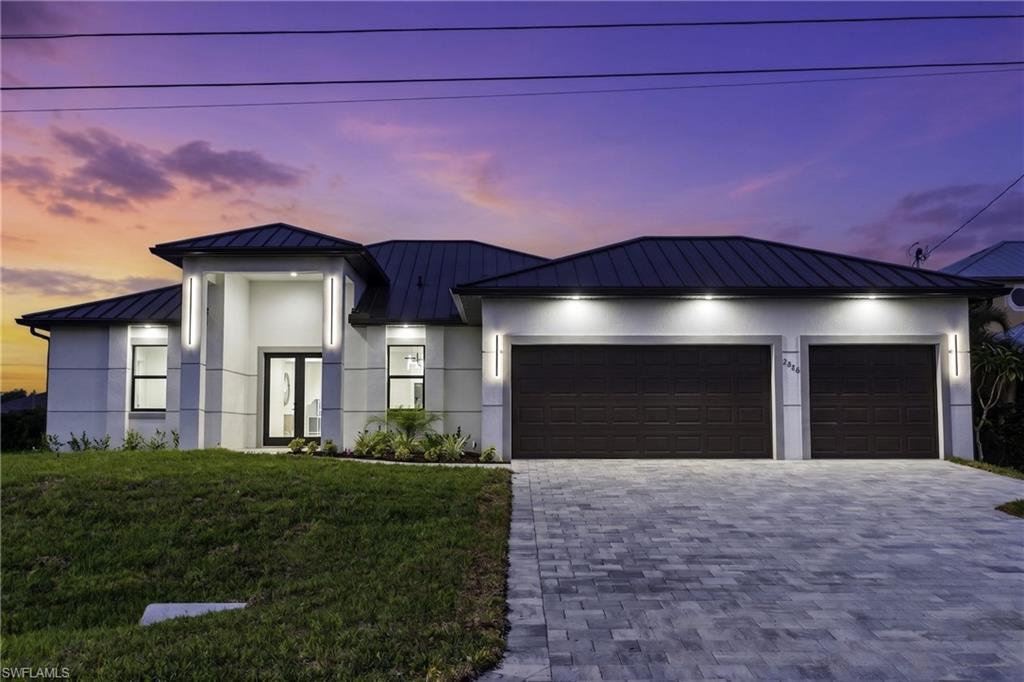 Image 3: Located in SW Cape Coral, durable METAL ROOF & 3-CAR GARAGE!
