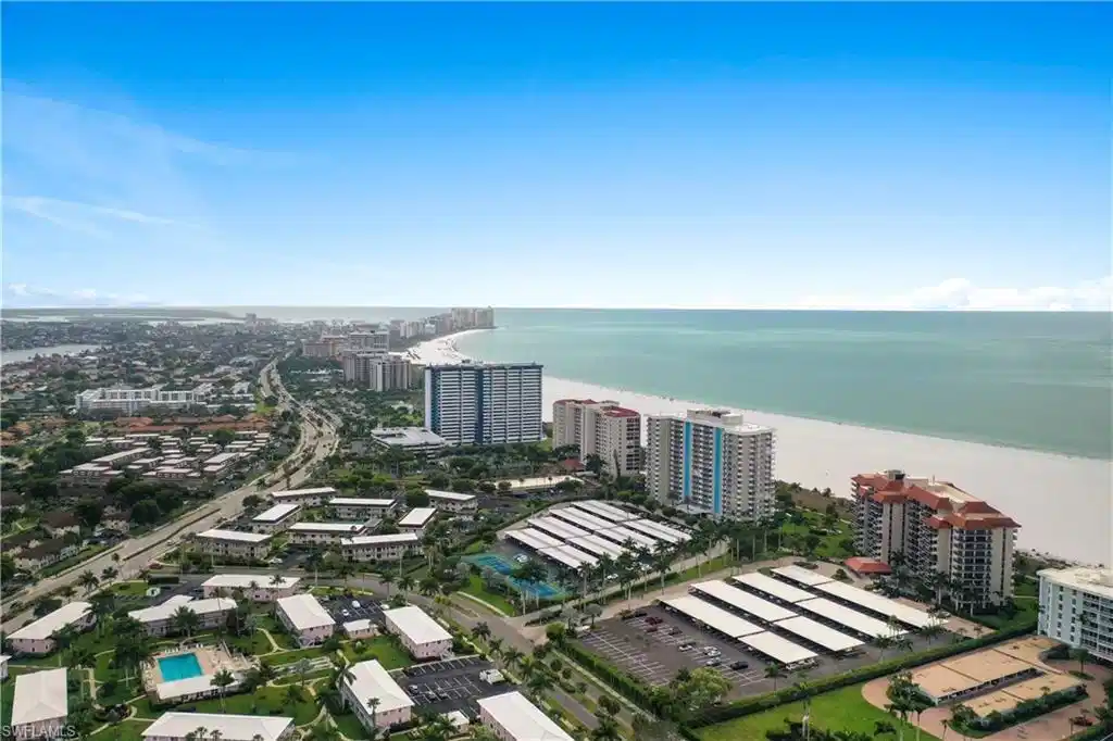 Image 1: View of urban area with expansive beach