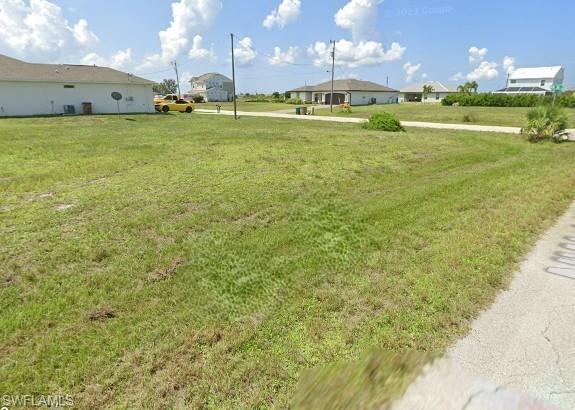 Image 2: View of grassy yard